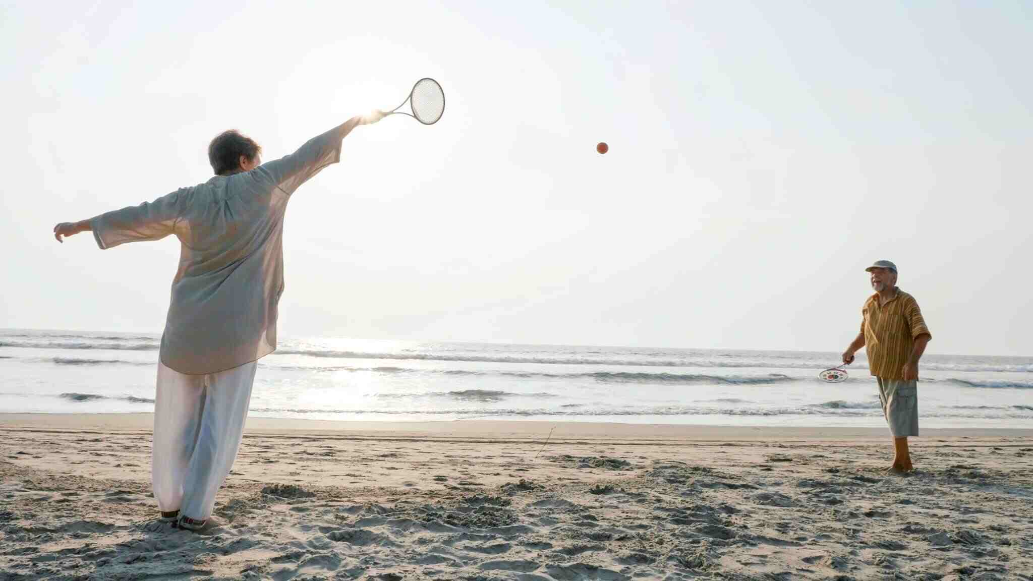 playing badminton on beach
